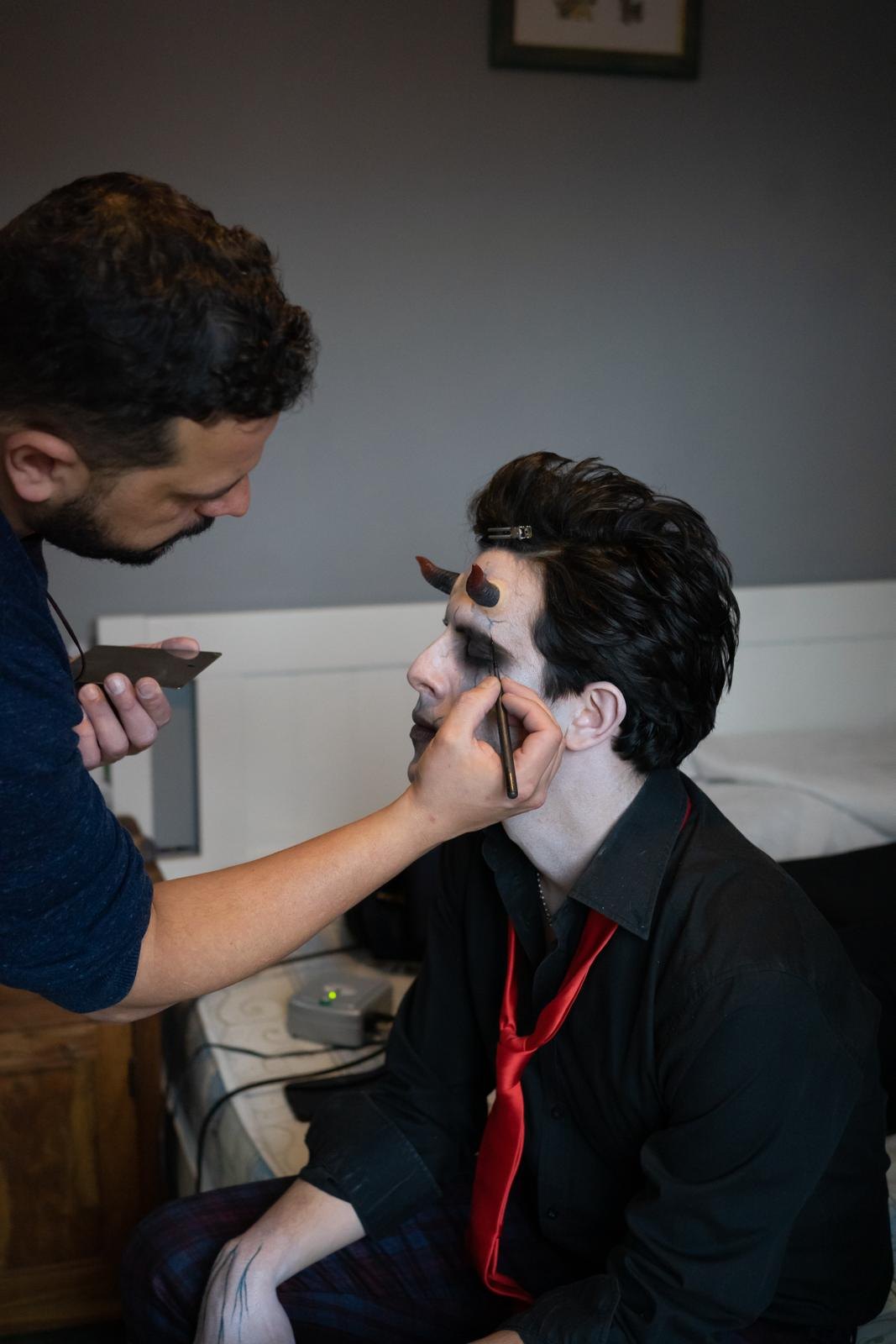 Rodrigo Pires applying character makeup during a transformation process