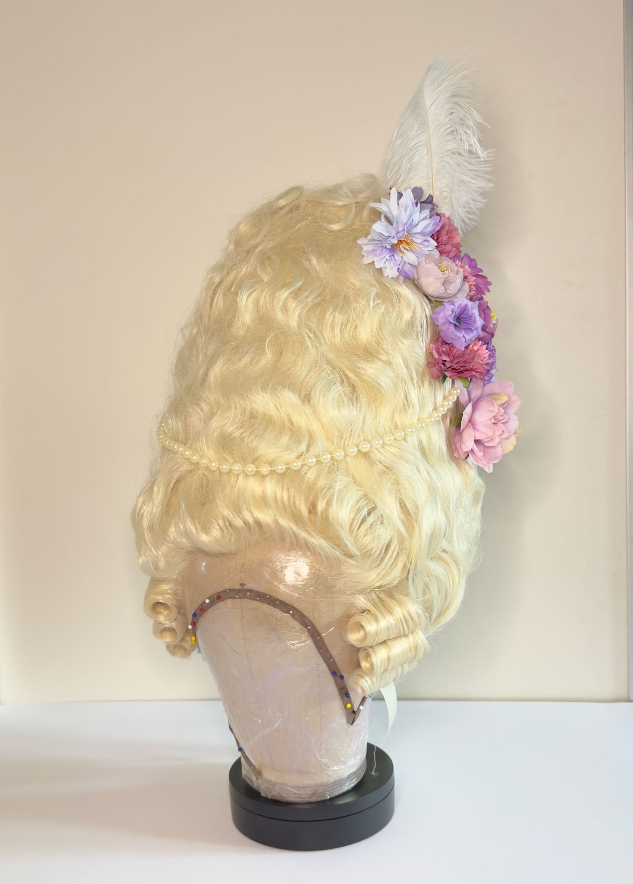 Finished period wig with flowers feather and pearl detailing